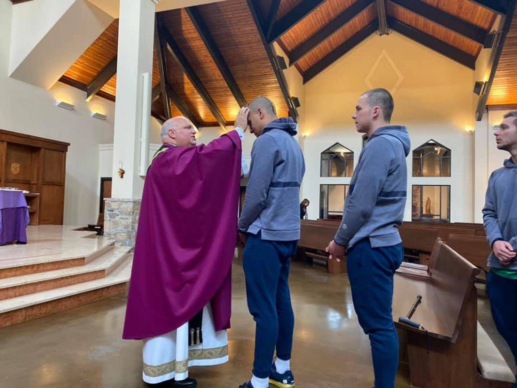 GREENSBORO — St. Pius X celebrated Ash Wednesday with a school Mass and a visit from the Notre Dame swim team. (Photos via Facebook)