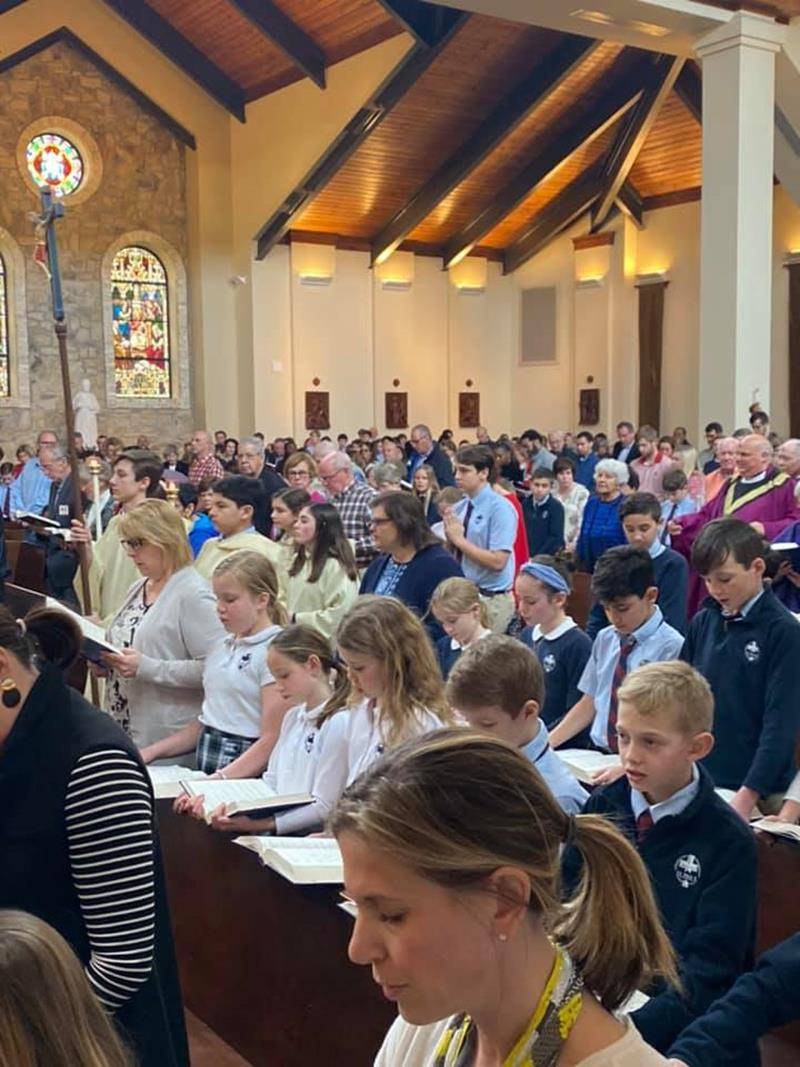 GREENSBORO — St. Pius X celebrated Ash Wednesday with a school Mass and a visit from the Notre Dame swim team. (Photos via Facebook)