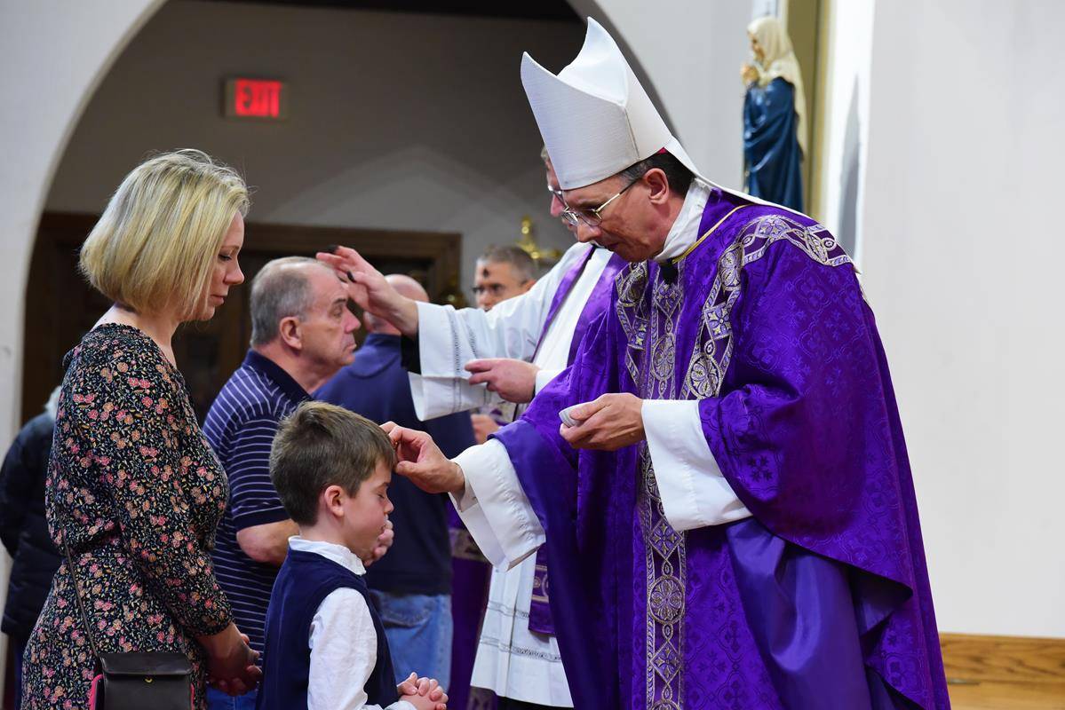 CHARLOTTE — Bishop Peter Jugis celebrated Mass on Ash Wednesday at St. Patrick Cathedral. (Photos by James Sarkis)