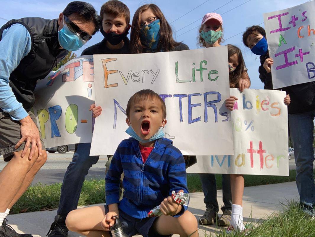 GREENSBORO — Parishioners of Our Lady of Grace Parish held signs as silent witnesses and prayed on behalf of the unborn at a Life Chain in Greensboro.  The life chain was held along one of Greensboro’s busiest streets, Battleground Avenue.  (Provided by N