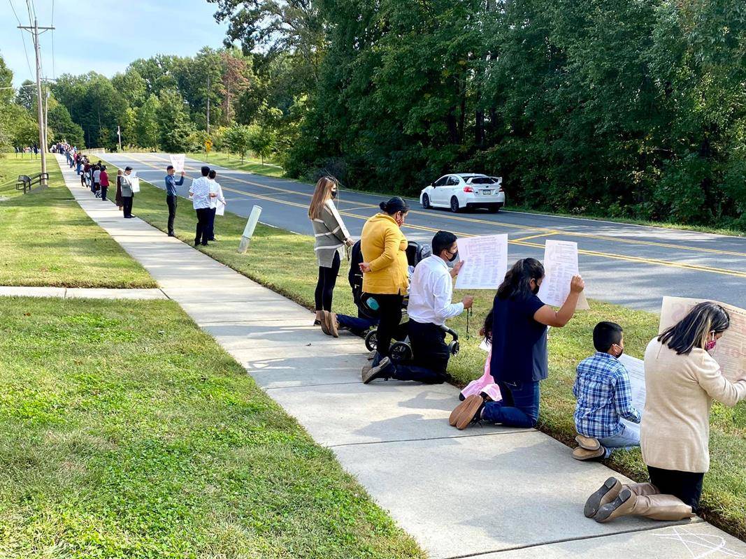 St. Mark Church’s Life Chain was held on Sunday, Oct. 4. Nearly 250 people came to silently pray along the sidewalk that spans from St. Mark Church to St. Mark School. (Photos provided by Amy Burger)