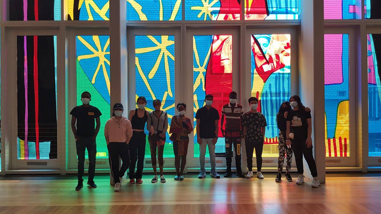 Some of the older campers pose in front of the Mint Museum’s large stained-glass art piece installed last fall. Students also visited Daniel Stowe Botanical Garden, Carowinds and Discovery Place.