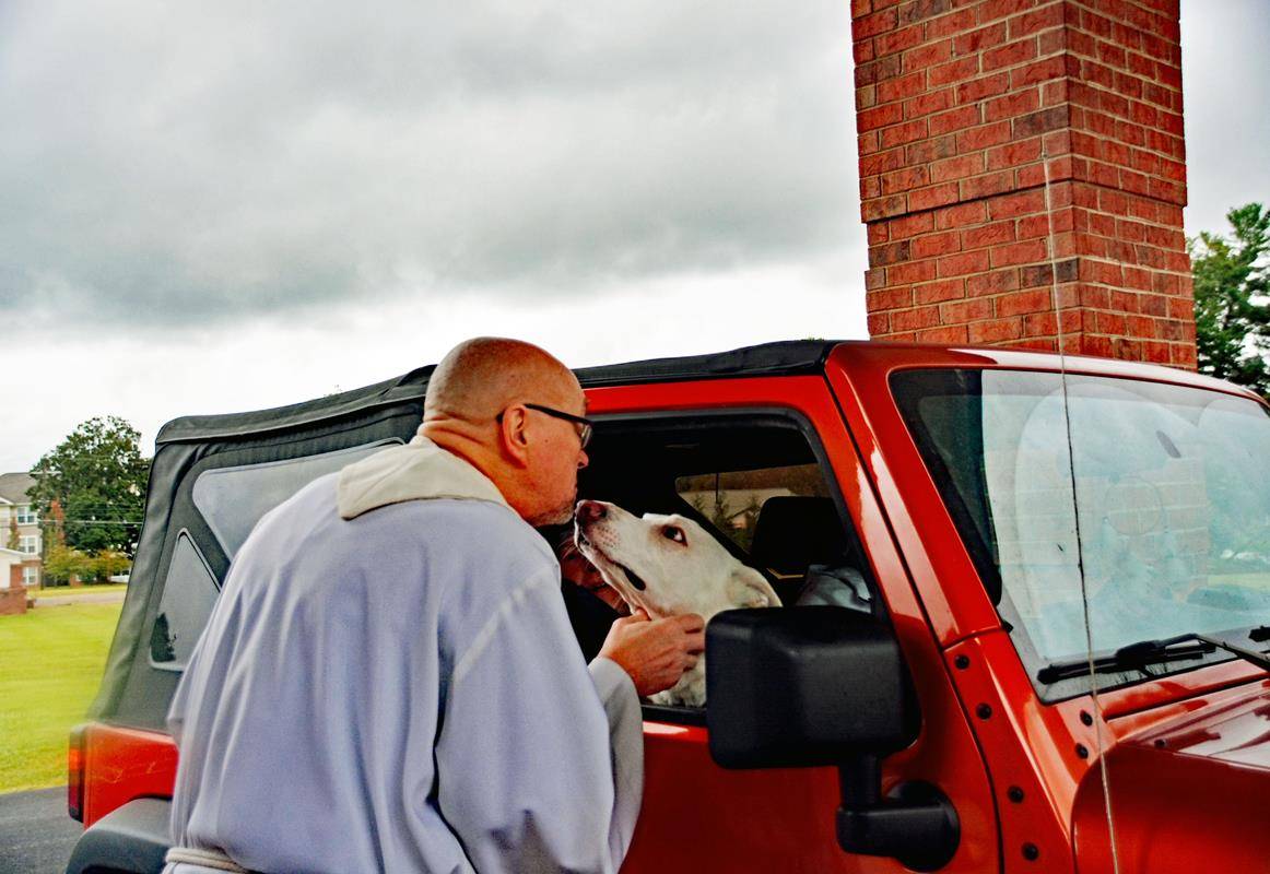 Neither wind nor rain from Hurricane Ian could keep pets in Mocksville from receiving a blessing from Father Eric Kowalski, pastor of St. Francis of Assisi Church, on Oct. 1.