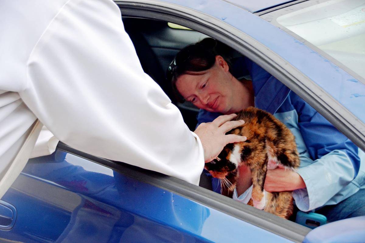 Neither wind nor rain from Hurricane Ian could keep pets in Mocksville from receiving a blessing from Father Eric Kowalski, pastor of St. Francis of Assisi Church, on Oct. 1.