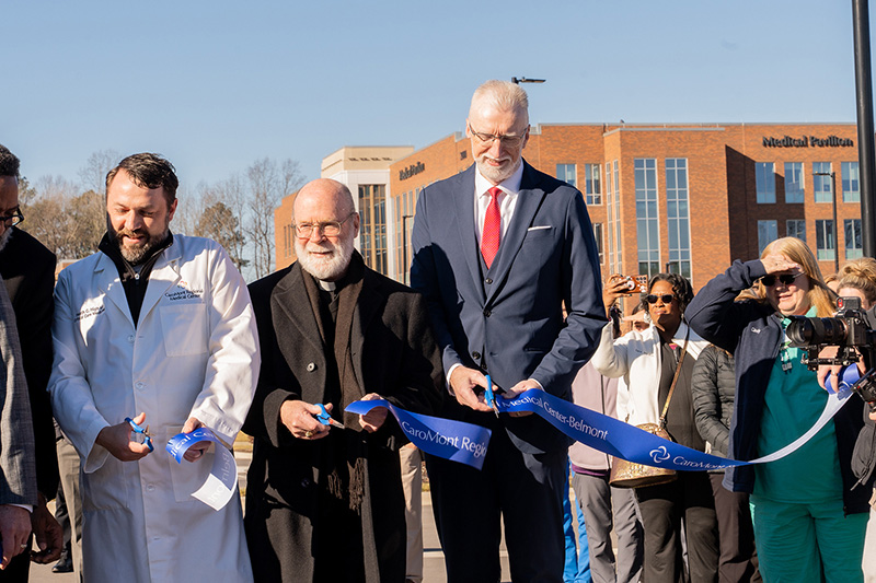 Officials from CaroMont Health and the college participate in a ribbon-cutting Jan. 8.(Photos provided) 